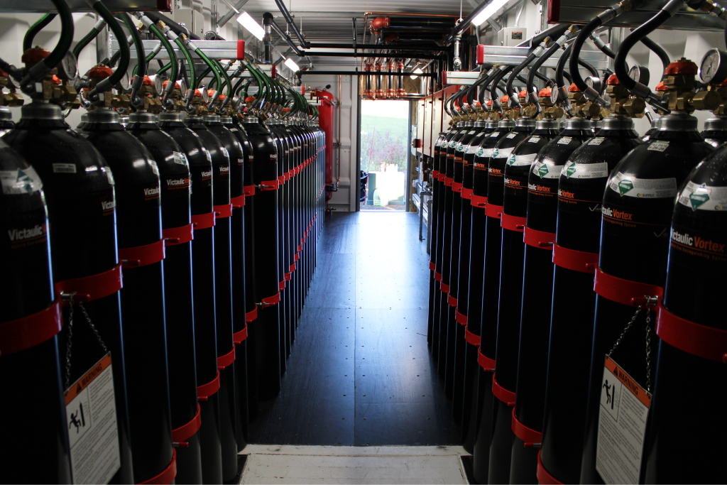 Aisle between rows of clean agent suppression cylinders